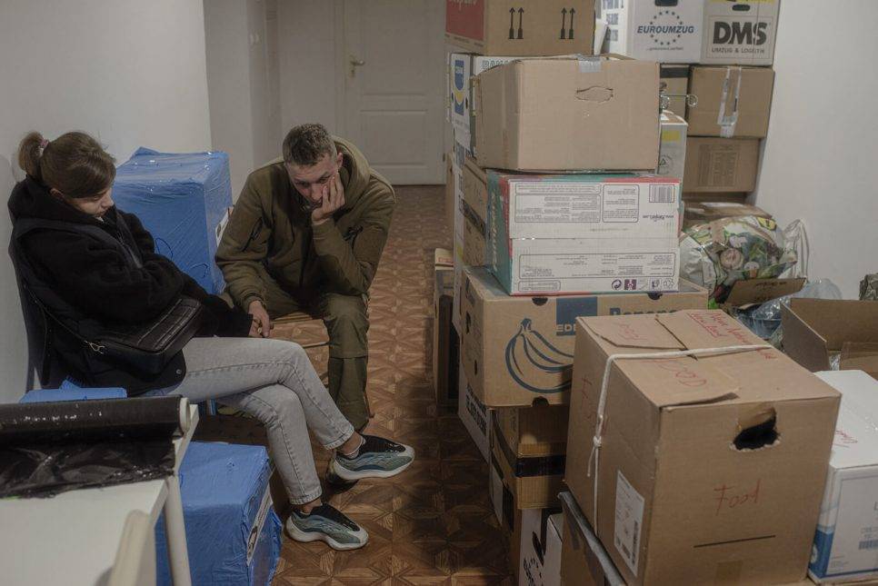Christina and her husband spend their last moments together at the Kalinouski Regiment's volunteer fighter recruiting centre in Warsaw, before her husband is sent to war in Ukraine. Photo: Pasha Kritchko