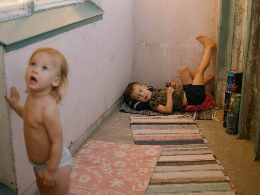 Jenya and his sister Evy playing at the balcony when visiting grandparents. Photo: Katerina Shosheva