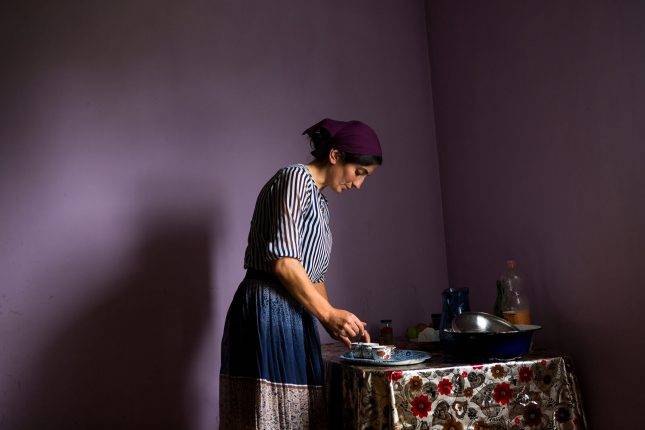 Maiko makes coffee for her guests, while her family is at the summer pastures. Photo: Natela Grigalashvili