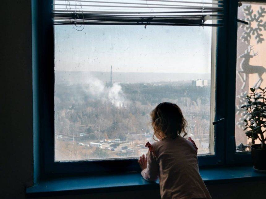 Amelia watching a fire burning in the botanical garden. Photo: Katerina Shosheva