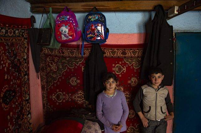 Shindan and his sister cannot go to school. However, they have very basic school items such as a schoolbag, a school diary, a notebook and pens. These limited items give those school-deprived children a sense of belonging to education. Photo: Orkhan Azimov